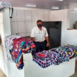 Agricultores familiares de Amambai exibem, orgulhosos, seus produtos no Mercado Municipal.